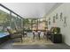 Enclosed lanai providing comfortable seating, creating an ideal spot for relaxation at 427 N Lakeview Ave, Winter Garden, FL 34787