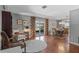 Spacious living room features hardwood floors and doors to the backyard pool at 427 N Lakeview Ave, Winter Garden, FL 34787
