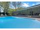 Sparkling pool with lounge seating and screened lanai offers a relaxing backyard retreat at 427 N Lakeview Ave, Winter Garden, FL 34787