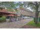Charming brick-paved street with sidewalk cafes and shops under a canopy of trees at 427 N Lakeview Ave, Winter Garden, FL 34787