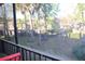 Enjoy the view from this screened-in balcony overlooking a green, tree-filled space at 429 Sheoah Blvd # 8, Winter Springs, FL 32708