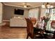 Open concept dining room and living room with modern lighting and floor to ceiling sliding doors at 429 Sheoah Blvd # 8, Winter Springs, FL 32708