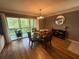 Dining room features a glass table, seating for four, and view of the outdoor balcony at 429 Sheoah Blvd # 8, Winter Springs, FL 32708