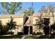 Exterior of two-story home with a well-maintained lawn and mature trees at 429 Sheoah Blvd # 8, Winter Springs, FL 32708