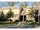 Close-up of a clean two-story condo building with mature trees and well-maintained landscaping at 429 Sheoah Blvd # 8, Winter Springs, FL 32708