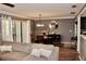 Cozy living room featuring hardwood floors, elegant furnishings, and a view of the dining area at 429 Sheoah Blvd # 8, Winter Springs, FL 32708