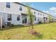 Townhouse backyard with small tree and a patio at 4337 Switchgrass Ln, St Cloud, FL 34772