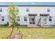 Townhouse backyard with small tree and patio at 4337 Switchgrass Ln, St Cloud, FL 34772