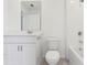 Well-lit bathroom features white cabinetry, a tub and shower combo, and modern fixtures at 4337 Switchgrass Ln, St Cloud, FL 34772