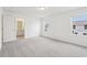 Bedroom with carpeted floor and an open doorway to the attached bathroom at 4337 Switchgrass Ln, St Cloud, FL 34772