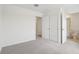 Neutral bedroom with carpet, featuring closet space and an ensuite bathroom for added convenience at 4337 Switchgrass Ln, St Cloud, FL 34772