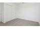 Bedroom with carpeted floor and a closet with double sliding doors at 4337 Switchgrass Ln, St Cloud, FL 34772