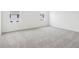Bedroom with carpeted floor, freshly painted walls, and two windows at 4337 Switchgrass Ln, St Cloud, FL 34772