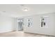 Bright living area with light colored flooring and views of the exterior and backyard at 4337 Switchgrass Ln, St Cloud, FL 34772