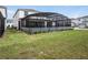 View of the backyard featuring a screened-in patio at 4361 Lana Ave, Davenport, FL 33897