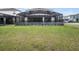 Large backyard with a screened-in patio, perfect for entertaining at 4361 Lana Ave, Davenport, FL 33897