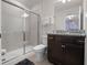 Bathroom featuring granite countertops, a shower, and a decorative mirror for a luxurious spa-like experience at 4361 Lana Ave, Davenport, FL 33897