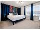 Cozy bedroom showcasing a comfortable bed, bright windows, and decorative blue accents at 4361 Lana Ave, Davenport, FL 33897