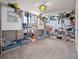 Unique ' bedroom featuring triple bunk beds and a whimsical jungle-themed wall design at 4361 Lana Ave, Davenport, FL 33897