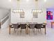 Dining room featuring a stylish table, chairs, and modern lighting at 4361 Lana Ave, Davenport, FL 33897