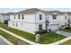 Corner lot featuring a well-maintained two-story home with lush green grass at 4361 Lana Ave, Davenport, FL 33897