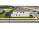 Exterior view of home, featuring a screened-in pool and nicely maintained lawn at 4361 Lana Ave, Davenport, FL 33897