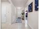 Bright foyer with white walls, tile flooring, decorative accents, and a welcoming ambiance at 4361 Lana Ave, Davenport, FL 33897