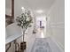 Inviting foyer with neutral walls, decorative molding, and a glimpse into the dining area at 4361 Lana Ave, Davenport, FL 33897