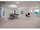 Spacious game room featuring a pool table and Mickey Mouse wall decor, perfect for entertainment and Gathering fun at 4361 Lana Ave, Davenport, FL 33897