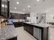 Spacious kitchen with granite countertops, stainless steel appliances, and ample cabinet space at 4361 Lana Ave, Davenport, FL 33897