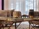Living room decor featuring a mirrored coffee table and stylish vases at 4361 Lana Ave, Davenport, FL 33897
