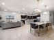 Spacious living area with a stylish couch, dining table, and a modern kitchen at 4361 Lana Ave, Davenport, FL 33897