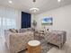 Living room with comfortable seating, stylish decor, and a large window at 4361 Lana Ave, Davenport, FL 33897