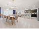 Open-concept living space with a modern kitchen, dining area, and comfortable seating at 4361 Lana Ave, Davenport, FL 33897