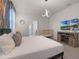 Comfortable main bedroom with a king bed, a crib, and a large-screen TV, creating a relaxing space at 4361 Lana Ave, Davenport, FL 33897