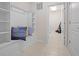 Functional mudroom features built-in shelving, a bench, and access to a laundry area at 4361 Lana Ave, Davenport, FL 33897