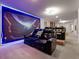 Home theater featuring plush seating and a futuristic theme, perfect for movie nights and entertaining guests at 4361 Lana Ave, Davenport, FL 33897