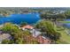 Stunning aerial view of the lakefront homes with private pools and lush green surroundings at 703 Cricklewood Ter, Lake Mary, FL 32746