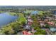 Gorgeous aerial view of golf course community and lake with homes with private pools at 703 Cricklewood Ter, Lake Mary, FL 32746