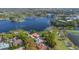 Picturesque aerial showcasing golf course and water views with stunning homes and lush landscaping at 703 Cricklewood Ter, Lake Mary, FL 32746