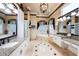 Elegant bathroom with dual sinks, soaking tub, and walk-in shower at 703 Cricklewood Ter, Lake Mary, FL 32746