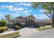 Attractive single-story home featuring lush landscaping, a brick driveway and a two-car garage at 703 Cricklewood Ter, Lake Mary, FL 32746