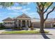 Stunning single-story home boasting an elegant exterior, manicured landscaping and a paver driveway at 703 Cricklewood Ter, Lake Mary, FL 32746