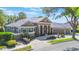 Elegant single-story house showcasing a manicured lawn and beautiful landscaping at 703 Cricklewood Ter, Lake Mary, FL 32746