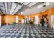 This garage features a checkered floor, white walls, a water heater, and other tools at 703 Cricklewood Ter, Lake Mary, FL 32746