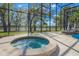Relaxing hot tub in the screened-in lanai area near the pool and lake views at 703 Cricklewood Ter, Lake Mary, FL 32746