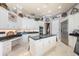 Spacious kitchen with white cabinetry, granite countertops, and stainless steel appliances at 703 Cricklewood Ter, Lake Mary, FL 32746