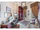 This home office is equipped with custom cabinetry, a computer, a printer, and a couch at 703 Cricklewood Ter, Lake Mary, FL 32746