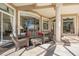 Covered patio featuring comfortable seating, tiled flooring, and large windows offering ample natural light at 703 Cricklewood Ter, Lake Mary, FL 32746