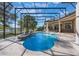 The luxurious screened-in pool features elegant fountains, a view of a nearby lake, and lush landscaping at 703 Cricklewood Ter, Lake Mary, FL 32746